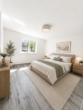 Modernes Wohnen mit Balkon – energieeffizient und zentrumsnah - Schlafzimmer KI-Visualisierung