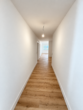 Erstbezug in Loxstedt-Nesse: Moderne 3-Zimmer-Wohnung mit überdachtem Balkon - Flur