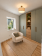 Erstbezug in Loxstedt-Nesse: Moderne 3-Zimmer-Wohnung mit überdachtem Balkon - Ankleideraum KI-Visualisierung